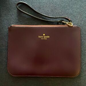 KATE SPADE ♠️ wristlet in plum.